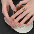 0.7 inch oval nude French pointed gold glitter wearing nail art