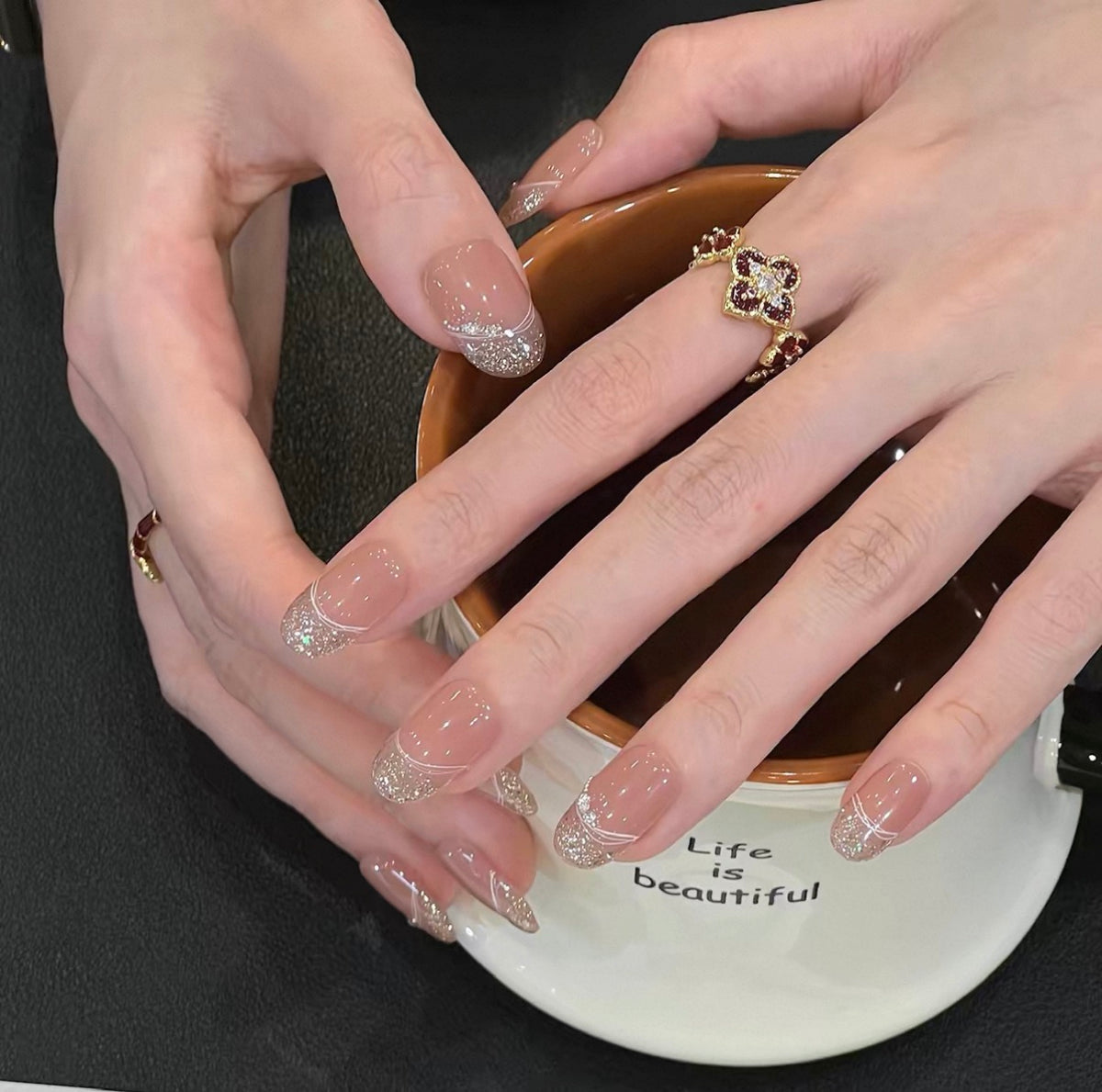 0.7 inch oval nude French pointed gold glitter wearing nail art